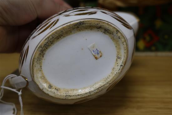 A Meissen floral encrusted cup and saucer, a similar teapot, a Chinese teabowl, two jugs and a scent bottle